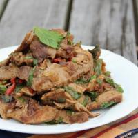 Nam Tok Salad · Grilled pork seasoning with fresh thai herbs, thai chili, roasted rice powder, and house dre...