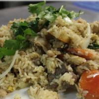 House Fried Rice · Rice stir-fried with egg, tomatoes, white onion, and green onion.
