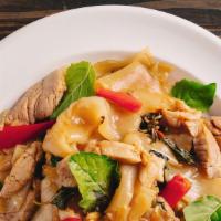Pad Kee Mao · Stir-fried flat rice noodle with egg, basil, mushroom, bamboo shoots, bell pepper, and in a ...