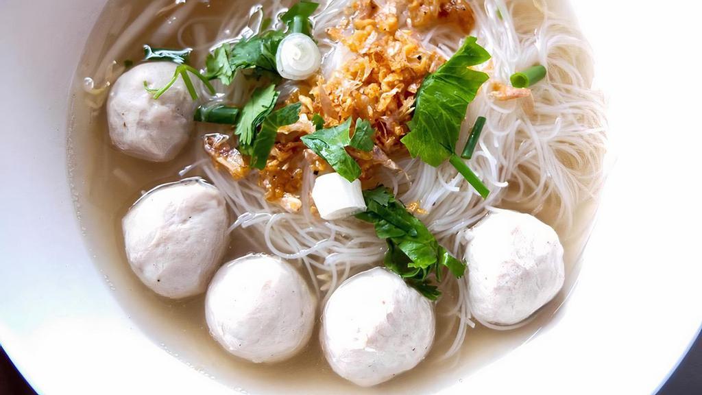 Meatball Noodle Soup · Rice noodle soup with beef meatballs and bean sprouts. Topped with fried garlic, cilantro, and green onion.