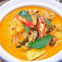 Pineapple Curry · Spicy thai red curry paste with coconut milk, pineapple, jalapeno, tomatoes, and basil.