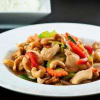 Pad Cashew · Stir-fried with cashew nuts, white onion, celery, bell pepper, carrot, and in a brown sauce.