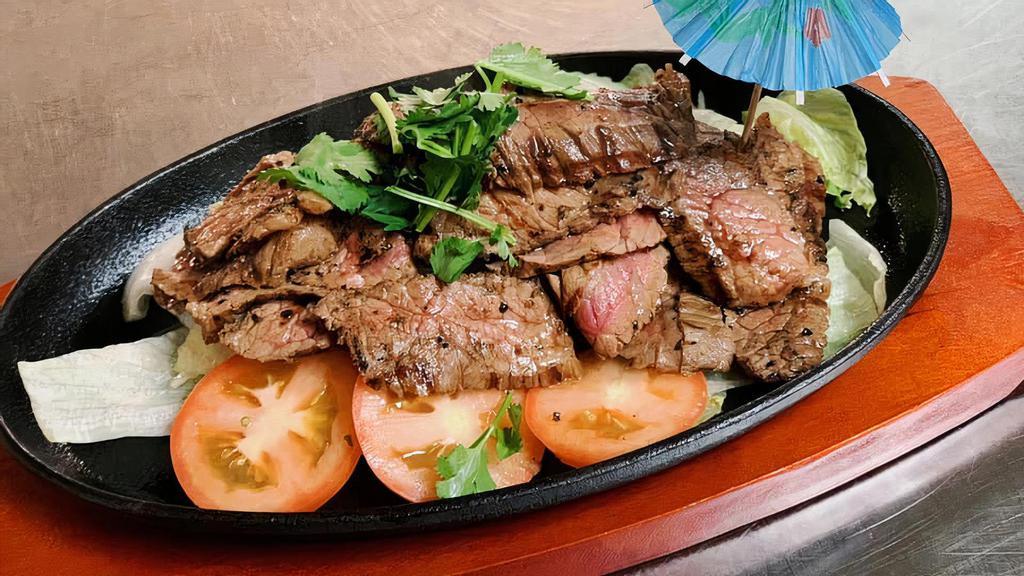 Tiger-Cry · 8oz. Grilled marinated sirloin steak. Served with spicy thai taste sauce, cucumber, tomatoes, and lettuce.
