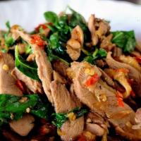 Duck Basil · Stir-fried duck breast with garlic, white onion, basil, jalapeno, and bell pepper in a brown...