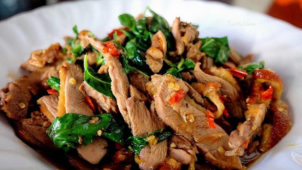 Duck Basil · Stir-fried duck breast with garlic, white onion, basil, jalapeno, and bell pepper in a brown sauce. Spicy.