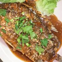Whole Fish Tilapia · Deep-fried whole tilapia top with choice of sauce sweet chili, basil sauce, red curry sauce,...