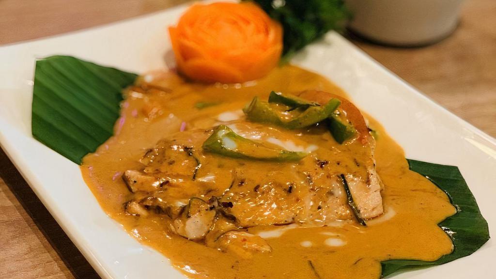 Chu Chee Salmon · Grilled salmon with special curry, coconut milk, broccoli, and lime leaf.