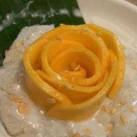 Sweet Stick Rice With Mango · Sweet sticky rice served with mango and coconut milk on top.