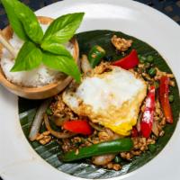 Pad Kra Prao · Onion, serrano, basil, garlic, green bean and chili served with fried egg. Served with white...