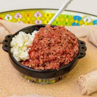 Beef Kitfo · Ethiopian steak tartar, from selected lean round steak seasoned with purified and herbed but...