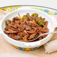 Awaze Tibs (Spicy)  · Cubed beef sautéed in a blend of spices, onions, garlic, ginger & Kibe’ (clarified butter). ...