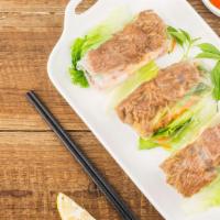 Grilled Beef Roll (2) · Hand rolled rice paper filled with grilled beef, vermicelli, lettuce, mint, cucumber and fri...