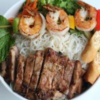 Beef Trio · Delicious Vietnamese grilled beef with a side of grilled shrimp and an egg roll over your ch...