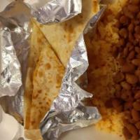 Kids Chicken Quesadillas · Served with rice and beans or french fries, a fountain soda, and ice cream.
