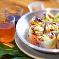 Fresh Spring Rolls · Lettuce, carrot, cucumber, tofu, red cabbage wrapped in rice paper and served with our both ...