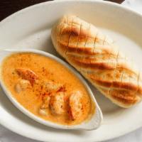 Bayou Shrimp · Sautéed gulf shrimp in a tangy sauce. Served bayou style with dipping bread.