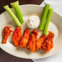 Chicken Wings · One pound of our award winning chicken wings served with bleu cheese or ranch dressing and c...