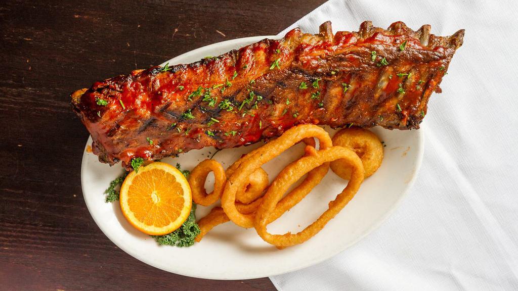 Bbq Baby Back Ribs · Half or whole rack of succulent baby back pork ribs, rubbed down, slow cooked, grilled and coated with our special BBQ sauce.