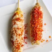 Elote Entero · Corn on a Cobb with butter, mayo, cotija cheese.
