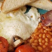 English · Two eggs sunny side up, one banger sausage link, slice of Irish bacon, tomato beans, fried t...