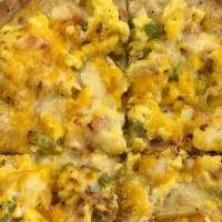 Breakfast Pizza  (Big Enough To Share) · Topped with monterey jack and cheddar, chorizo gravy, scrambled eggs, diced tomatoes, green ...