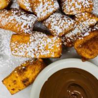 Dough Boyz · Fresh fried dough pillows dusted with cinnamon sugar and served with Nutella dip.. A BP favo...
