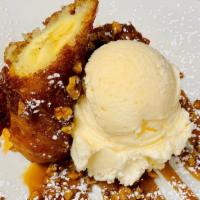 Fried Banana Foster · Banana dipped in buttermilk batter and fried till golden and crisp. Dusted with cinnamon sug...