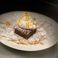Brownie Sunday · Warm decadent chocolate chip brownie, topped with caramel sauce, vanilla ice cream and whipp...