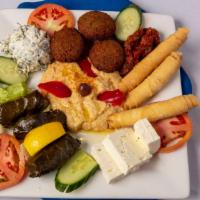 Istanbul Blue Platter · Combination of appetizers: Three cigara boreks, three yaprak, dolmas, hummus, feta cheese & ...