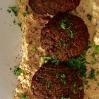 Falafel · Vegetable balls of chickpeas, onions, cilantro, cumin seeds served with tahini with hummus s...