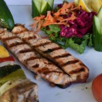 Salmon Fillet (Gluten Free) · Grilled salmon filet served with a side of rice or vegetables skewer.