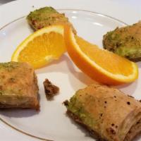 Baklava · Sweet pastry baked with pistachio, finished with sugar syrup.
