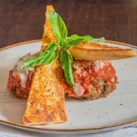 Twin Jumbo Meatballs · Two pork veal & beef meatballs stuffed with mozzarella and topped with house marinara, shave...
