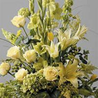 Mache In Yellow · Mache vase with all yellow glads, roses, lilies, and green bells. Product ID: JHS-1634.