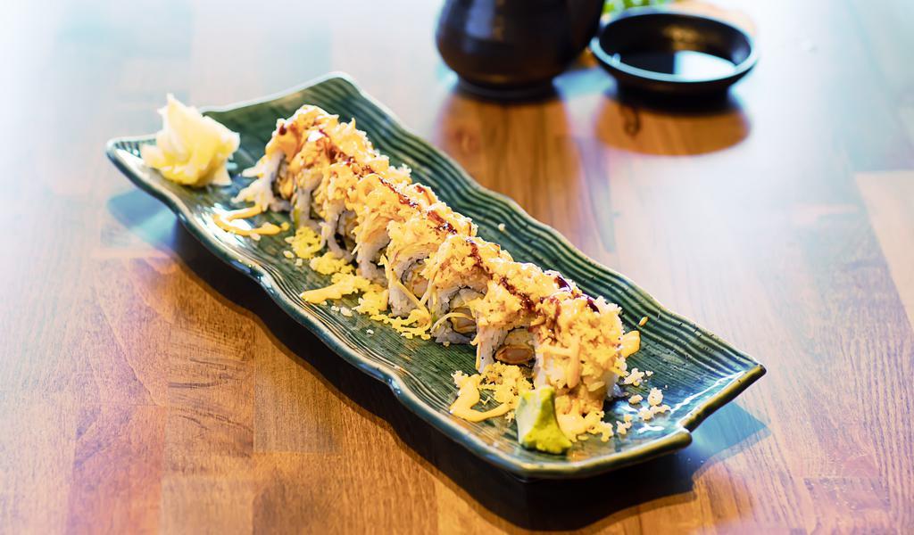 Tokyo Mama Roll · Shrimp tempura, cucumber, mayo topped with spicy crab and tempura bits with special house sauce.