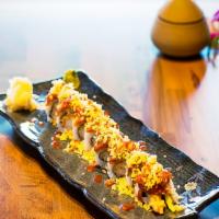Oishii Roll · Shrimp tempura, avocado, and cucumber topped with spicy tuna, tempura bits and special house...