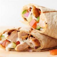 Chicken Shawarma · Marinated spiced chicken served on  tortilla bread  with pickles and garlic sauce.