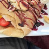 Fruit Crepe · Strawberry jelly, strawberry, peach, banana, blueberry, with strawberry or chocolate syrup.