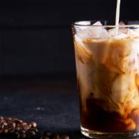 Iced Latte · Deep dark espresso shots over ice and cold milk.