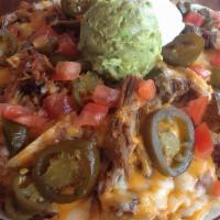 Nachos Villa · Chips smothered with re-fried beans, jack and cheddar cheese, tomatoes and jalapenos. Served...