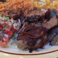 Carnitas Plate · Slow braised pork carnitas cooked to perfection. Served with pico de gallo, guacamole, Spani...