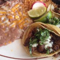 Three Tacos Callejeros · Street tacos (small tortilla) with cilantro, onion, your choice of meat and salsa. Served wi...