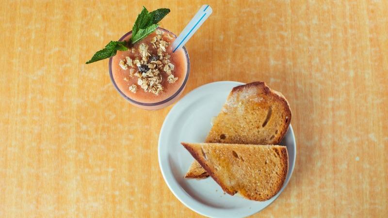 Cruiser Smoothie · Cruiser smoothie. Cantaloupe, banana and strawberries blended with fresh OJ, granola, honey and a little ice. Served with organic honey wheat toast. 