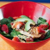 Strawberry Spinach Salad · Fresh spinach, red onion, strawberries, cucumbers, walnuts and avocado served with strawberr...