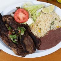 #36. Costilla De Res · Grilled beef ribs, served with nice, beans, salad, avocado and tortillas.