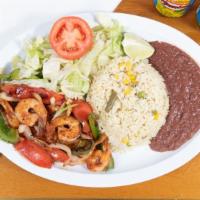 #5. Camarones A La Plancha · Grilled shrimp served with salad, avocado, cheese, lemon, rice, beans and tortillas.