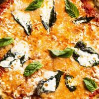 Margherita Pizza · Mozzarella, basil, garlic, EVOO.
