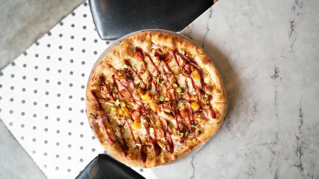 The Baby Daddy Pizza · Olive oil, garlic, fresh and shredded mozzarella, brown sugar BBQ pulled chicken, fresh red onion, cherry tomatoes, finished with BBQ sauce and scallions
