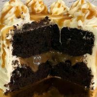 Chocolate Caramel Cake · Chocolate cake with caramel filling, white buttercream icing with caramel drizzle