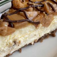 Toffee Crunch Cheesecake · A light and fluffy New York style cheesecake topped with pieces of toffee and drizzled with ...